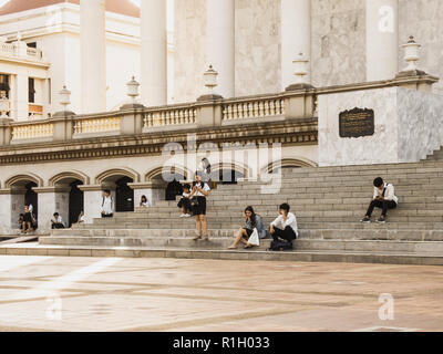 Samut Prakan, Thailand - November 12th, 2018: Thai students in Assumption University Bangna Campus waiting for the bus Stock Photo