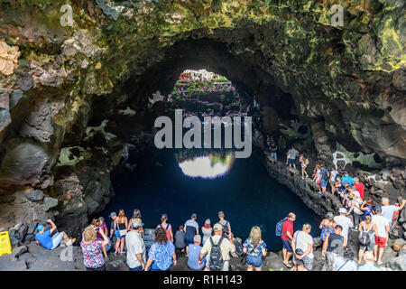 Crowds of tourists entering the vulcanic cave at Jameos del agua, Lanzarote Canary islands Stock Photo