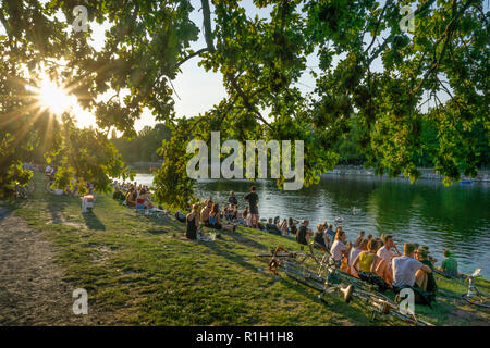 people relaxing at Urbanhafen (Urban Harbour) in summer , Landwehrkanal , Kreuzberg, Berlin, Germany Stock Photo