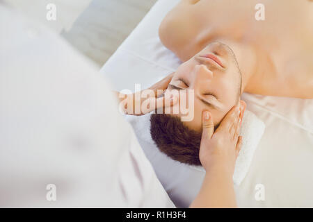 Facial massage for man.  Stock Photo