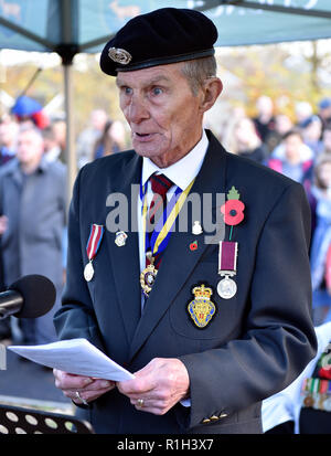 Former serviceman speaking during Remembrance Sunday, War Memorial, Bordon, Hampshire, UK. 11.11.2018.