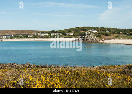 The beautiful Great Par or Great Porth beach with golden sand, pebbles, turquoise sea and blue sky. Bryher, Isles of Scilly UK Stock Photo