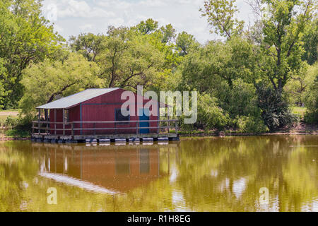 A floating fishing dock on a lake in Sedwick County park in Wichita, Kansas, USA. Stock Photo