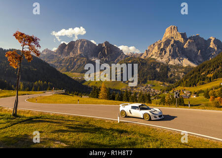 Lotus sports car on autumn road, Alta Batia, Hochabteital, Autumn, Dolomites, South Tyrol, Italy Stock Photo