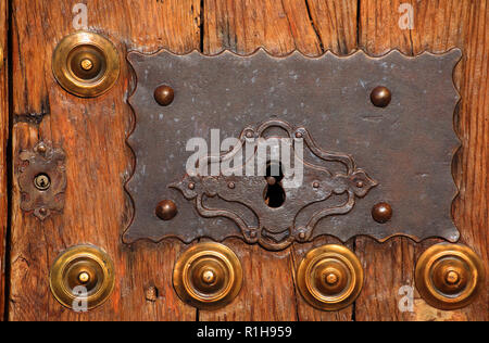 Arcos de la Frontera historical centre, Cadiz, Andalusia, Spain. Detail of typical old medieval, wood and iron studded door detail. Stock Photo