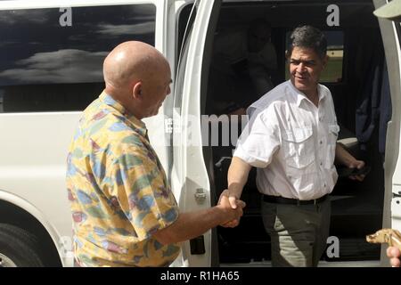 Harry Farmer, deputy director, S-3, Marine Corps Base Hawaii (MCBH), welcomes Rep. Filemon Vela (D-TX), House of Homeland Security Committee, Border and Maritime Security Subcommittee aboard MCBH during his visit at the base headquarters building, Sept. 19, 2018. Rep. Filemon Vela (D-TX) and Rep. Steve Cohen (D-TN), House of Judiciary Committee, visited MCBH to learn about the installation's support to operational readiness while maintaining awareness of cultural and environmental issues within the training areas, ranges and other aspects of the region. With this engagement, the Representative Stock Photo