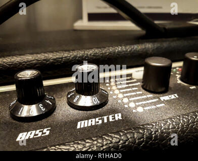 Guitar amplifier knobs closeup. Bass, Master, Presets. Stock Photo