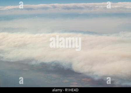 Aerial view of clouds and forest fire smoke, United States. Stock Photo