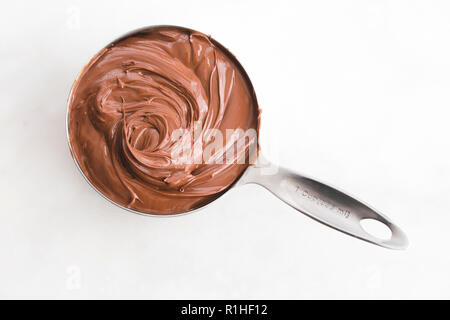 Measuring Cup of Hazelnut Spread Stock Photo