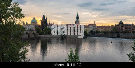 Old town view from across the Vltava River with dramatic Sunrise views of historical buildings in this popular destination. Stock Photo