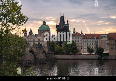 Old town view from across the Vltava River with dramatic Sunrise views of historical buildings in this popular destination. Stock Photo