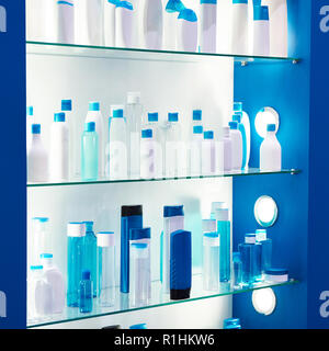 Showcase shop with plastic bottles and jars cosmetic and shampoo Stock Photo