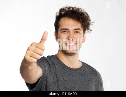 Young man and okey sign isolated on white background Stock Photo