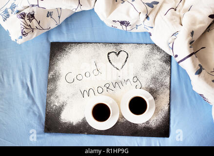 good morning inscription flour on a board-Valentine's day, sunny morning. Stock Photo