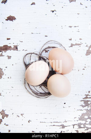 eggs lie on an old white table. Stock Photo