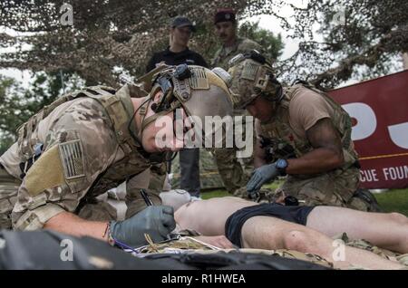 Pararescuemen perform battlefield trauma skills during the 2018 PJ Rodeo Sept. 19, 2018, at Travis Park in San Antonio, Texas. The PJ Rodeo is a friendly, but tough competition, tailored to test the skills, tactics, techniques and procedures being employed by today’s USAF Pararescuemen. Every two years, Active Duty, Air Force Reserve, Air Force Guard, and retired PJs gather to honor the legacy of USAF Pararescue, and to remember and celebrate teammates who gave all. Stock Photo