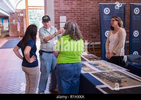 SPRINGFIELD, Mass. (September, 22 2018) Cecilia Sequeira, public affairs specialist, and Ashley McLendon, archivist, both with the Naval History and Heritage Command, interact with a Navy veteran at the Lyman and Merrie Wood Museum of Springfield History during Springfield Navy Week. Navy Weeks are designed to connect the public with Navy Sailors, programs and equipment throughout the country. Every year, America's Navy comes home to approximately 15 cities across the country to show Americans why having a strong Navy is critical to the American way of life.