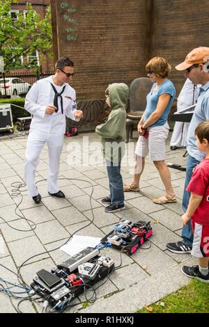SPRINGFIELD, Mass. (September, 22 2018) Musician 1st Class Colin Greggs, Portsmouth, Va. native and guitarist for Navy Band Northeast's 'Rhode Island Sound' interacts with fans following a performance at the Dr. Seuss National Memorial Sculpture Garden during Springfield Navy Week. Navy Weeks are designed to connect the public with Navy Sailors, programs and equipment throughout the country. Every year, America's Navy comes home to approximately 15 cities across the country to show Americans why having a strong Navy is critical to the American way of life.