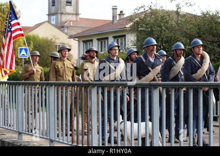 Brig. Gen. Frederick R. Maiocco Jr., commander of the U.S. Army Reserve’s 7th Mission Support Command, joined his Soldiers, reenactors and dignitaries from France and the U.S. in honoring the U.S. Army’s 16th Infantry Regiment, 1st Infantry Division’s historical crossing of the bridge at the village of Nonsard, France, during the WWI Centennial Celebration, Sept. 22, 2018. Stock Photo