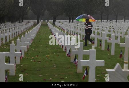 Service members, reenactors and dignitaries from France and the U.S. commemorated the 100th anniversary of the Meuse-Argonne Offensive during a World War I ceremony held at the Meuse-Argonne American Cemetery in France, Sept. 23, 2018. Thunderstorms and gale-force winds did not prevent crowds from honoring those who sacrificed all for peace. Stock Photo