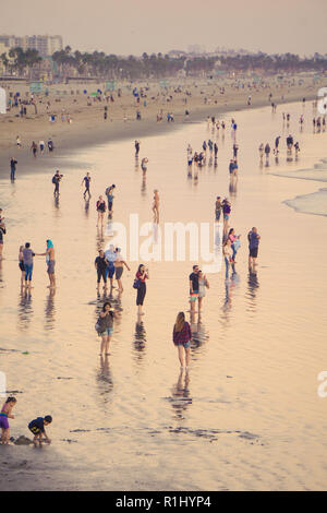 Crowds of people on Santa Monica Beach at sunset Stock Photo