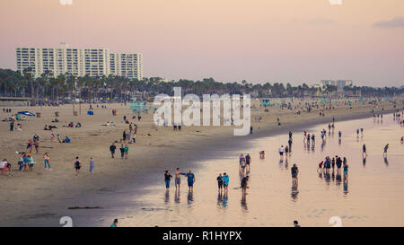 Crowds of people on Santa Monica Beach at sunset Stock Photo