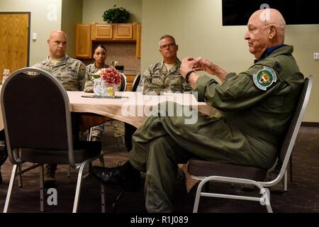 Lt. Col. John Yuill, right, shares his story of survival and triumph after he and his crew bailed out of a badly damaged B-52 over Hanoi, Vietnam, during a luncheon at Sheppard Air Force Base, Texas, Sept. 21, 2018. Yuill was captured soon have touching ground and would be a resident at the Hanoi Hilton for the remainder of the war. Stock Photo