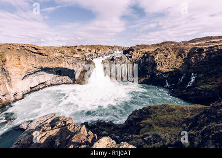 Aldeyjarfoss is where one can find both spectacular waterfall and basalt columns in Iceland. Stock Photo