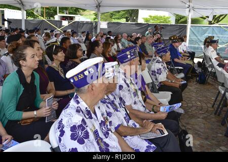U.S. military service members, former prisoners of war, families and veterans gather during a ceremony for National POW/MIA Recognition Day at the National Memorial Cemetery of the Pacific, Honolulu, Hawaii, Sept. 21, 2018. National POW/MIA Recognition Day, first established in 1979 through a proclamation from President Jimmy Carter, is an observance to honor and recognize the sacrifices of those Americans who have been prisoners of war and to remind the nation of those who are still missing in action. DPAA is conducting worldwide operations to provide the fullest possible accounting for those Stock Photo