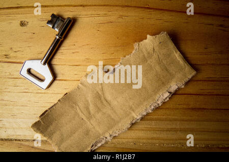 SUCCESS CONCEPTUAL with rustic  brown board and key. Stock Photo