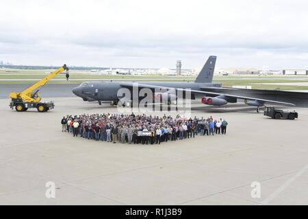 Personnel from the 565th Aircraft Maintenance Squadron, Oklahoma City Air Logistics Complex, gather for a group photo in front of B-52H Stratofortress 60-0058 on Sept. 24 at Tinker Air Force Base. 60-0058 completed overhaul here almost two weeks ahead of schedule on Sept. 14th and is the 17th aircraft produced in fiscal year 2018 meeting the programmed goal of 17 aircraft. The aircraft was delivered to the 2nd Bomb Wing, Barksdale Air Force Base on Sept. 25, 2018. Also shown are major pieces of ground support equipment used during the overhaul process. Stock Photo