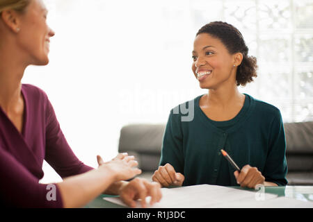 Happy colleagues working together on a project. Stock Photo