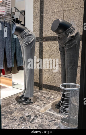 Traditional Japanese Bowing. Even these two shop mannequins are bowing in Japan, greeting visitors in a Kyoto fashion store on Teramachi Street. Stock Photo