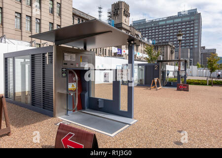 Entrance booth of a Giken Eco Cycle automated underground bicycle parking in front of Kyoto City Hall, Japan. Stock Photo