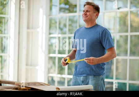 Mid adult man working on a construction site. Stock Photo