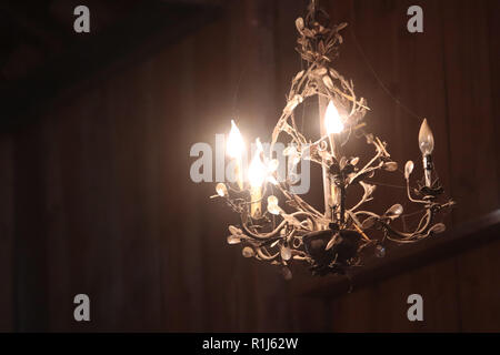 A chandelier hanging in a old barn Stock Photo