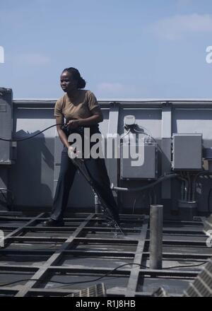 https://l450v.alamy.com/450v/r1j8hb/gulf-of-aden-oct-3-2018-quartermaster-2nd-class-falilatou-ghaumbada-assigned-to-whidbey-island-class-dock-landing-ship-uss-rushmore-lsd-47-sprays-the-deck-of-the-bridge-wing-while-participating-in-a-fresh-water-wash-down-during-a-regularly-scheduled-deployment-of-the-essex-amphibious-ready-group-arg-and-13th-marine-expeditionary-unit-meu-the-essex-arg13th-meu-is-lethal-flexible-and-persistent-navy-marine-corps-team-deployed-to-the-us-5th-fleet-area-of-operations-in-support-of-naval-operations-to-ensure-maritime-stability-and-security-in-the-central-region-connecting-to-the-m-r1j8hb.jpg