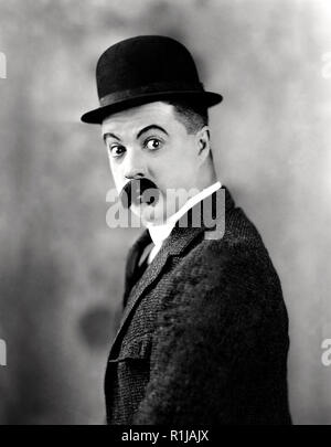 circa 1924:  Billy Bevan, the stage name of William Bevan Harris (1887 - 1957) the wide-eyed comedian of the silent screen, wearing a distinctive moustache. He was Australian and moved to Hollywood as part of Mack Sennett's troupe.Billy Bevan, a native Australian, came to America in 1917 and got a job as a supporting comic at the L-KO Studios. Two years later he became a the star of his own two-reel comedies with Mack Sennett Studios. With his bushy mustache and quizzical determination, Bevan delighted audiences with his antics up until the beginning of the sound era. He continued his career i Stock Photo