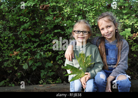 Two sisters posing outside Stock Photo