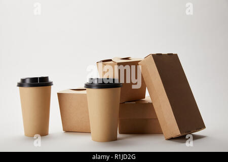 disposable coffee cups and cardboard food boxes on white Stock Photo