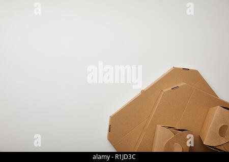 top view of cardboard pizza and noodle boxes on white surface Stock Photo