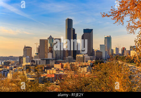 Seattle downtown skyline  at sunset in the fall with yellow foliage in the foreground view from Dr. Jose Rizal Park Stock Photo