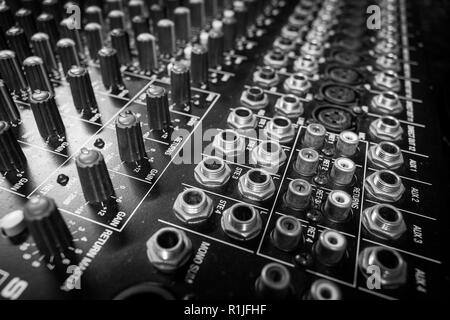 Professional Audio Mixing Console input gain control knobs and audio eq controls Stock Photo