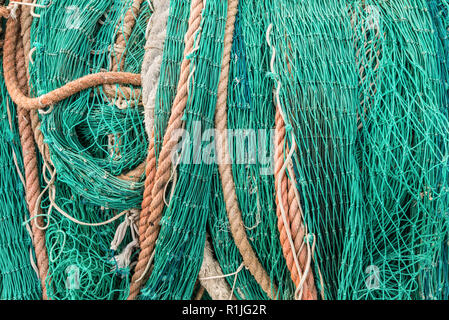 Close up a piled of commercial fishing net background Stock Photo