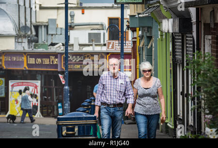 UK Weather: Aberystwyth, Ceredigion, West Wales Monday 18th July 2016. Holiday makers and locals alike take advantage of the early morning Sun to walk Stock Photo