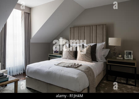 Grey and white toned bedroom Stock Photo