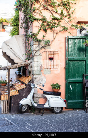 View of an iconic Italian scooter in an alley, Ischia, Gulf of Naples, Campania region, Italy Stock Photo