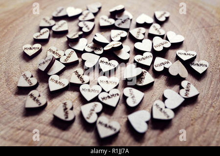 Mr and Mrs wedding decoration hearts on a wooden table Stock Photo