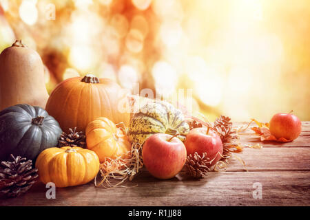 Thanksgiving, fall or autumn greeting background with pumpkin on table Stock Photo
