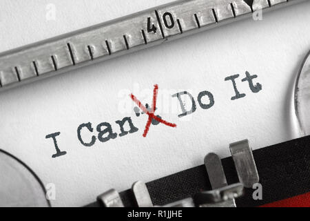 Can't crossed out to read I can do it concept for self belief, positive attitude and  motivation written on an old typewriter Stock Photo